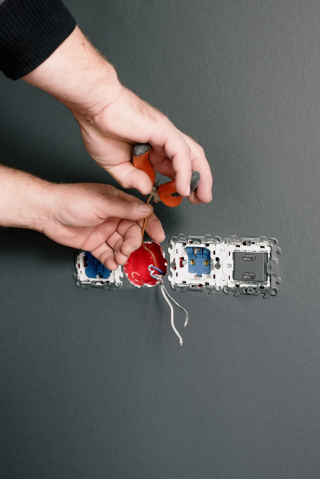 Stripping conductors at an outlet box, for outlet installation in Oakville