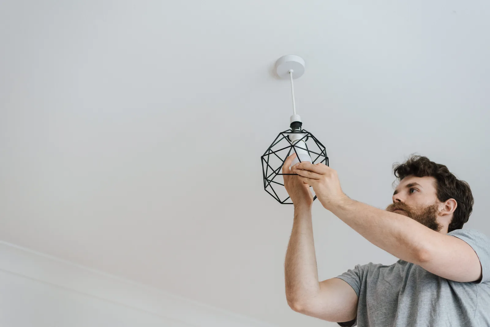 Fitting a lamp into a pendant fixture, for ceiling fan installation in Oakville